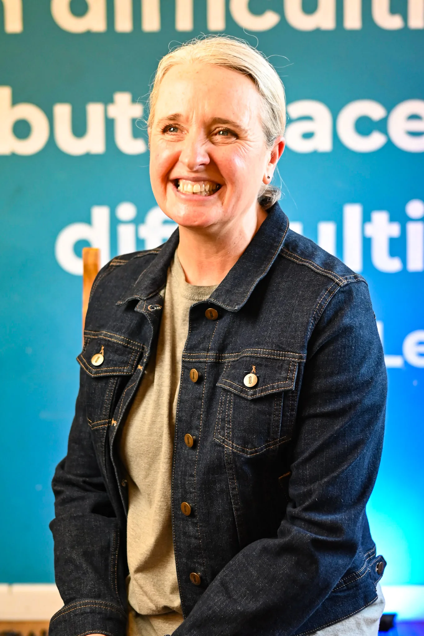 Business portrait against a blue backdrop — Bromley Photography, Chislehurst